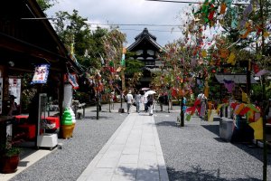 The path to the temple looks very festive flanked by the decorated bamboo branches