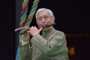 Mr.&nbsp;Sukeyasu Shiba, a prominent artist in Gagaku music, plays fue&nbsp;(Shinto flute) for the attentive audience