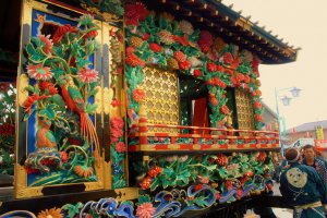 While most floats are detailed carvings, this float stands proud in a rainbow of painted colors