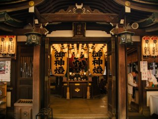 A prayer is going on inside the shrine.