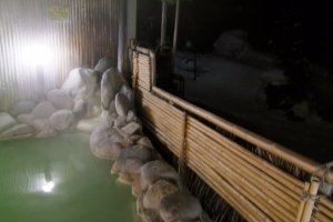 Outdoor hot spring bath, overlooking snowy surroundings