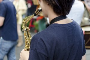 A Jazz player performing in the plaza