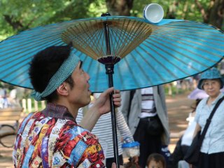 Spinning sake cup on a Japanese umbrella