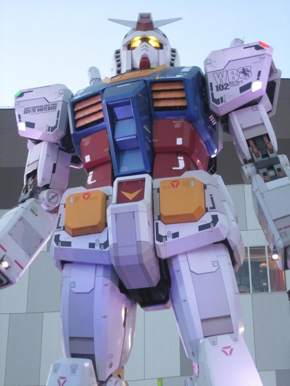 Front of Gundam at dusk with lit up eyes