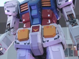 Front of Gundam at dusk with lit up eyes