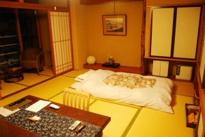 A traditional Japanese-style room with futon