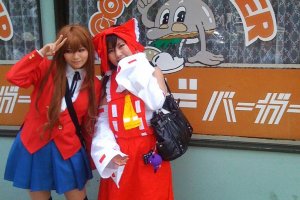 Cute Cosplay Couple in front of (old style) God Burger