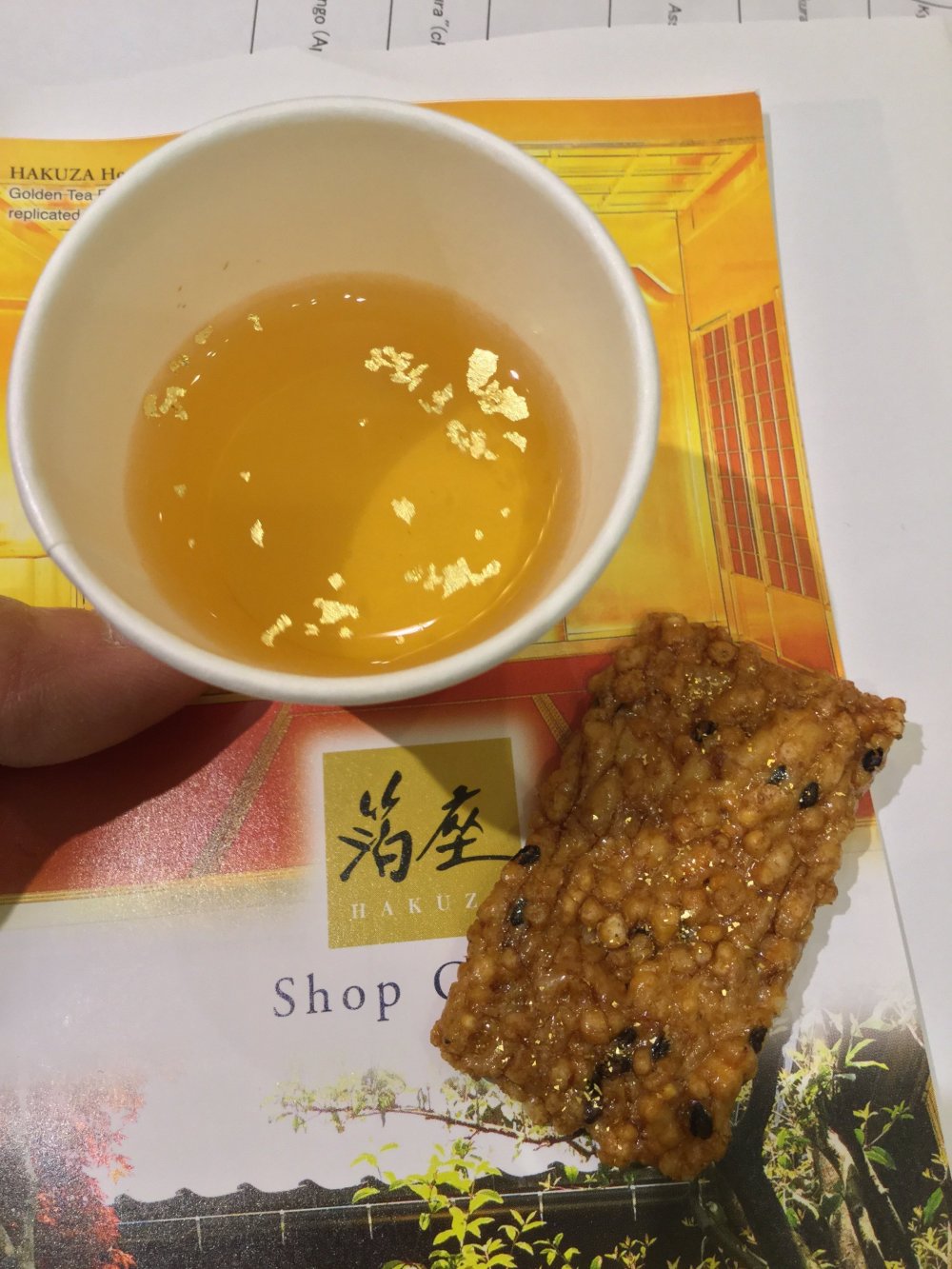 Gold flakes on tea and embedded in rice crackers.