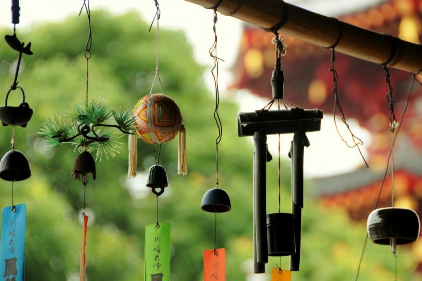 Furin beautifully displayed in front of the temple\'s pagoda