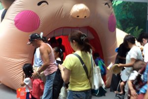 Enter the exhibition through a giant inflated mouth