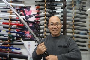 Sankai-do&#39;s owner, Kamegaya-san, holding a Samurai sword.