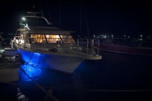 The night-cruising boat glows with blue LEDs underneath