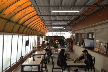 Customers enjoying snacks and coffee in Tado Green Farm cafe