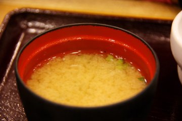 <p>Miso soup has a light brown color and mellow taste. The saltiness is at the right amount. It is easy to drink with soft textured tofu and seaweed.</p>