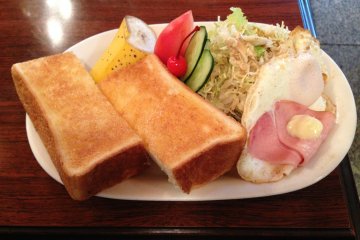 <p>Thick Toast, Eggs, Ham and a salad with creamy sesame dressing.</p>
