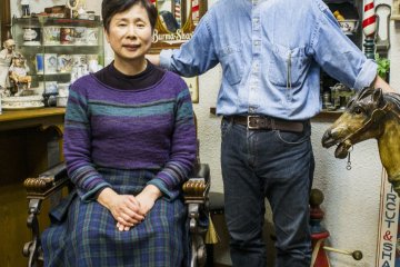 <p>The elderly couple who runs the barbershop-turned-museum.</p>