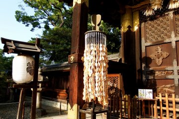 <p>Gentle breeze flutters gourd-shaped Ema (wish plaques) hanging from Kara-Mon gate</p>