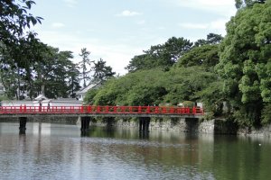Beautiful red bridge over the moat