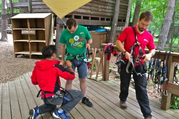 First stop, Safety Harness Station. Ask questions if you&#39;re at all feeling uncertain at this point because once you&#39;re all secured, you&#39;re moving onto the practice obstacle.