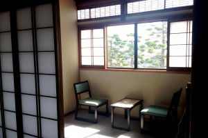 Read a book or relax in the sun room in your mini apartment at&nbsp;Kagetsu Ryokan hotel about 30 minutes from Maizuru Cruise Ship Terminal
