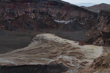 <p>The crater floor of an extinct caldera where rain water has created beautiful pattern and shades.</p>