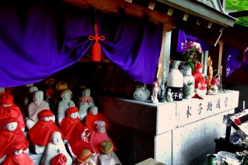 <p>Small &#39;Mizuko Jizo&#39; statues. &#39;Mizu&#39; means water, &#39;ko&#39; is child, and Mizuko signifies children who were washed away by water...usually it means babies who weren&#39;t born (died at birth or were aborted)</p>