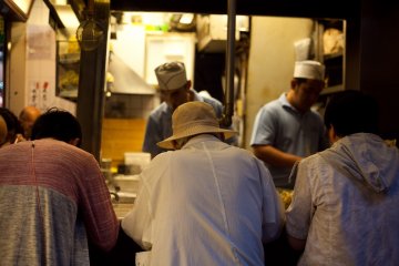 <p>Guests dine at one of the many yakitori shops</p>