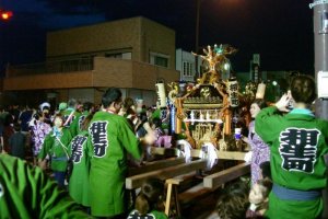 Hanyu Natsu&nbsp;matsuri - local men wearing happi&nbsp;coats and shorts carry portable shrines through the streets while chanting together