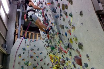 <p>The rock climbing wall is over two stories tall and has many different routes you can take</p>