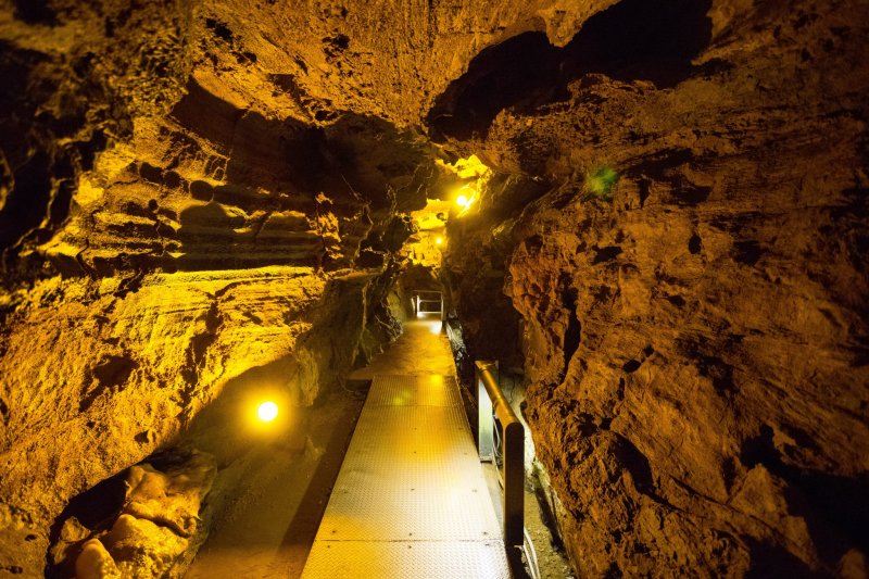<p>Illuminated path inside the cave</p>