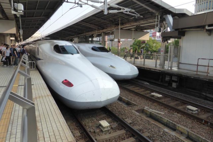 Two Shinkansen heading in opposite directions at Nagoya Station