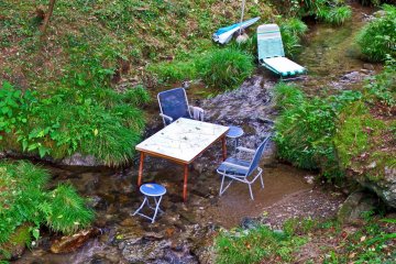 <p>Teatime anytime! Quite what these tables and chairs are doing in the middle of this river is anyone&rsquo;s guess; teatime in the river perhaps. I wonder if this is a trend which will take off?</p>