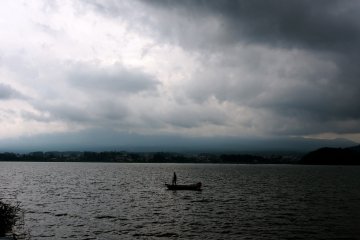 <p>A lone fisherman on Lake Kawaguchi</p>