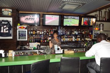 <p>Bar counter with Julie the manager. Always has a smile!</p>