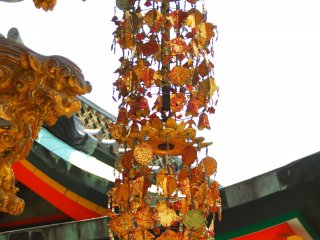 A golden decoration hanging from the ceiling of Koyomon Gate. The glitter makes the gate look more gorgeous