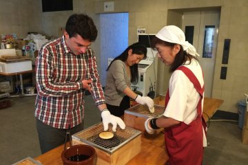 <p>At the station, for a couple hundred yens you can learn how to make senbei...</p>