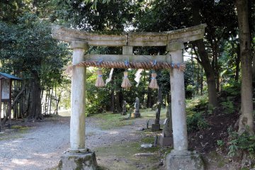 <p>The stone torii gate stands at the entrance of &#39;Thirty-three Kannon Bosatsu&#39; pilgrimage path in the woods</p>