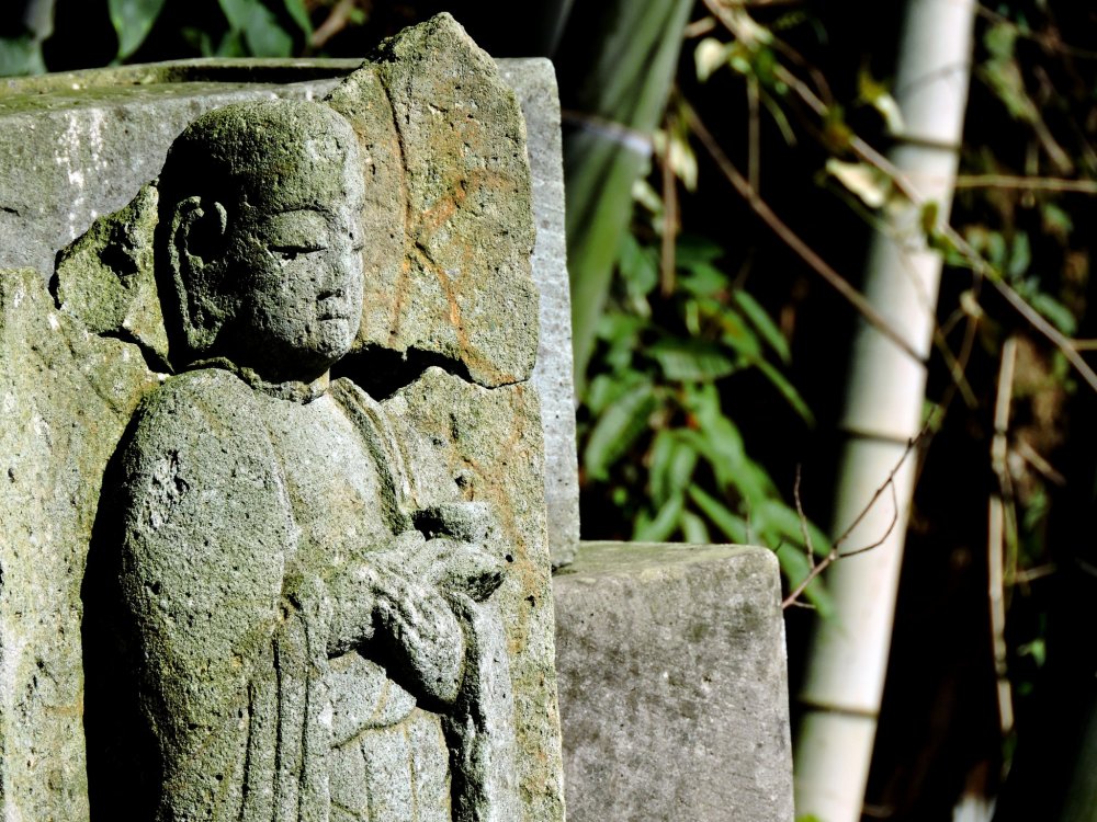 One of the small jizo statues sitting in its final resting place