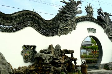 <p>Magnificent dragons undulate along the top of the wall &nbsp;</p>