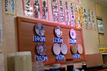 <p>These plates indicate the prices of the sushi dishes</p>