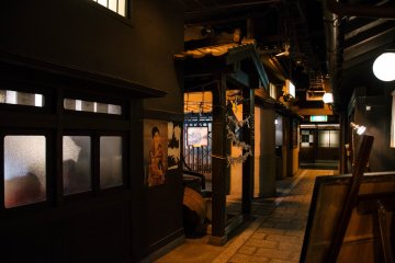 <p>A stone walkway along the dimmed lanterns recreates the feeling of walking back in time through an old alleyway.</p>