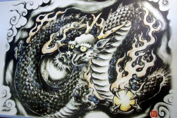 <p>A painting of the Black Dragon displayed on the shrine grounds</p>