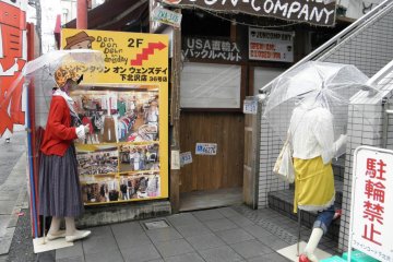 <p>Two dummies advertising for a shop</p>
