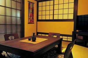 The beautiful tatami mat living room had a low floor level window, which is an unusual architectural feature