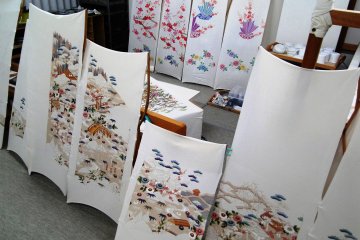 <p>Painted silk panels in the yuzen workshop</p>