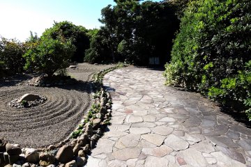 <p>Paved pathway to the entrance to the cave</p>