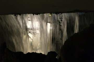 Venture behind the waterfall for a unique perspective.