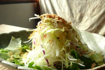 <p>A shredded cabbage salad with a zesty dressing is the starter for all lunch sets</p>