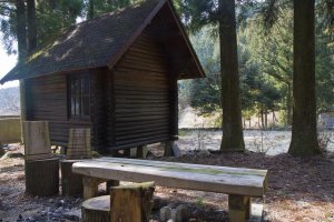 One of a half-dozen little log cabins