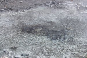 Hot water bubbling up from below the earth&#39;s surface